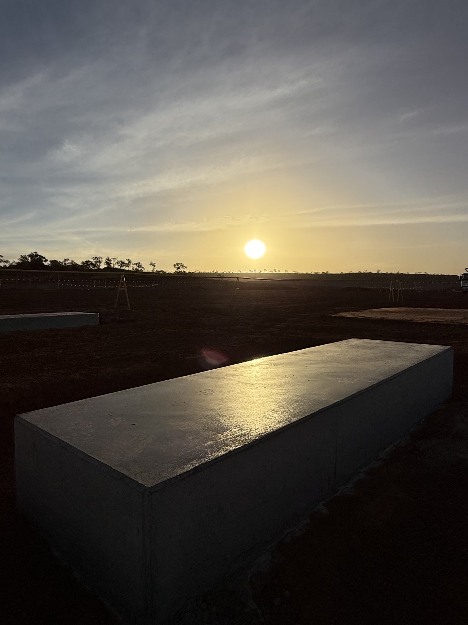 Finished concrete pad in golden hour light